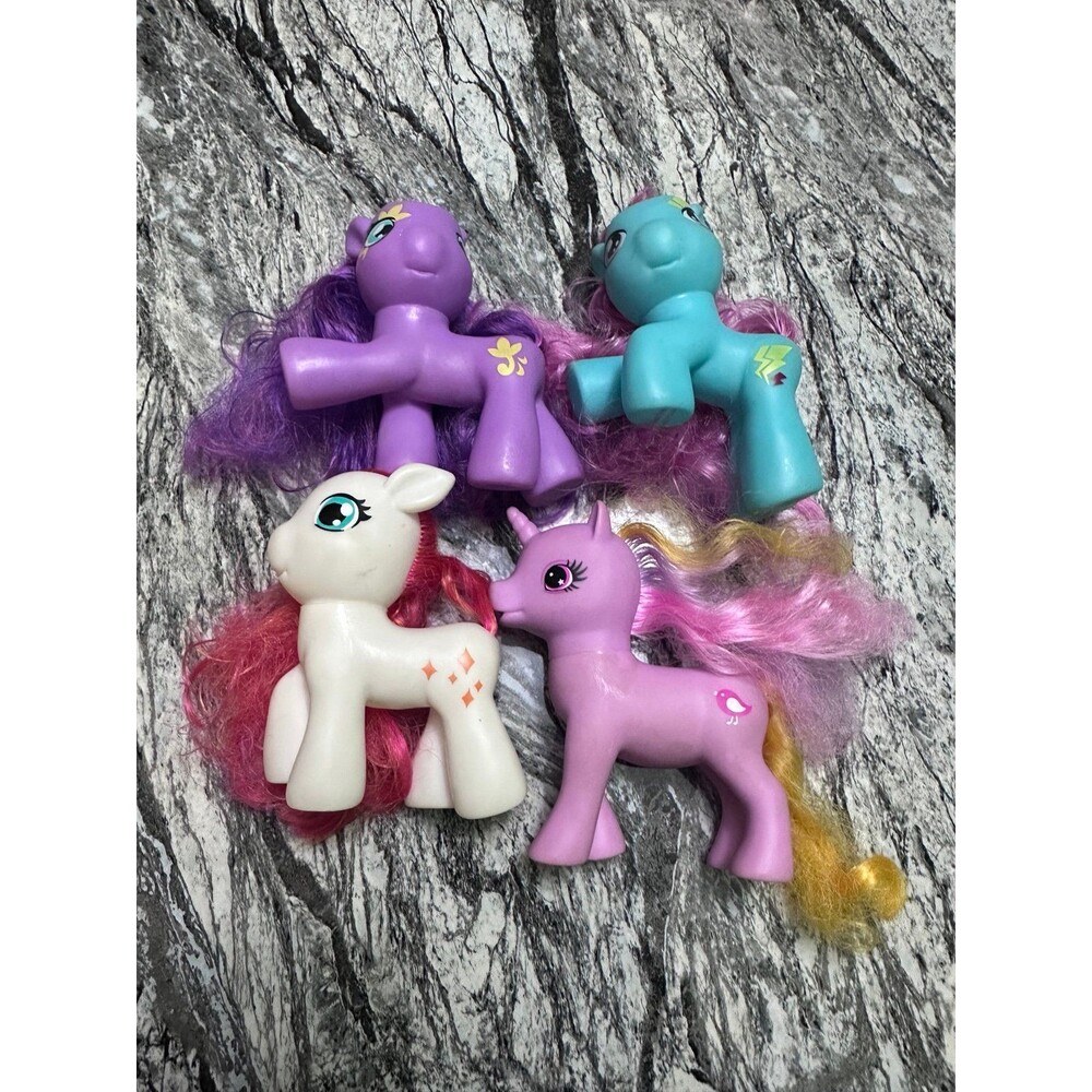 Pony Toys - Lot of 4 - Purple, Pink, White, Blue
